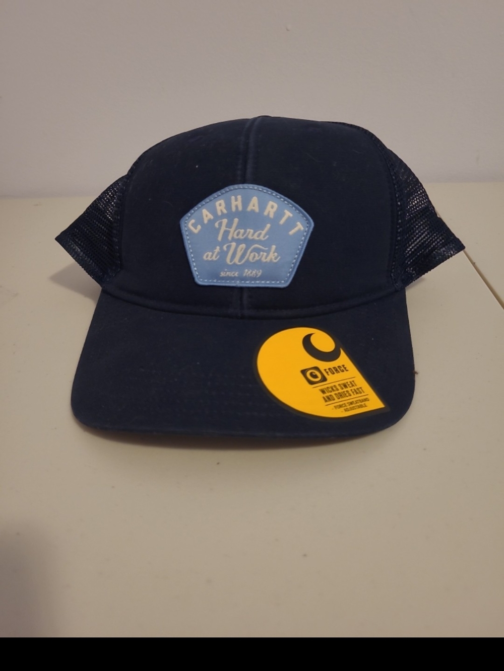 Carhartt Navy Hat with Yellow Logo Sticker